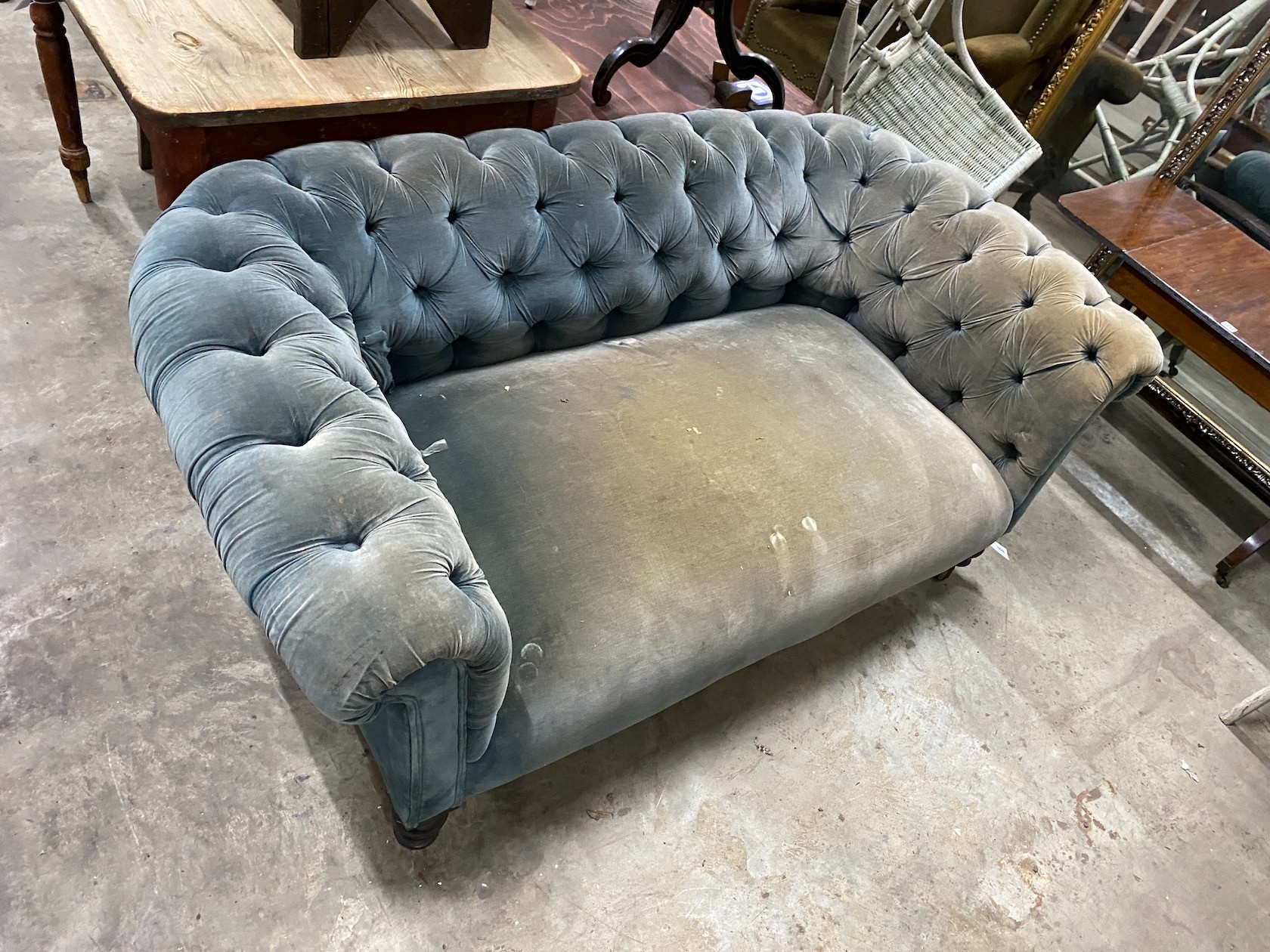 A late Victorian Chesterfield settee upholstered in buttoned blue fabric, length 160cm, depth 86cm, height 66cm
